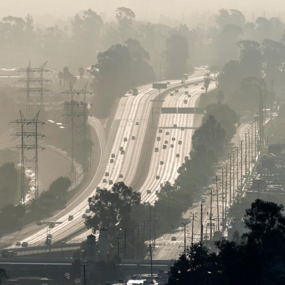 image of big city freeways with smoke