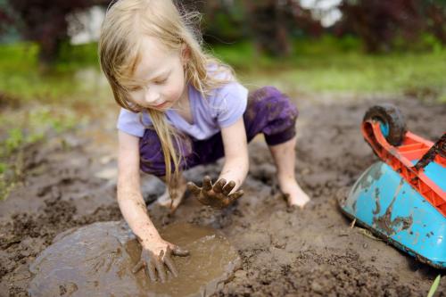 kid playing in dirt