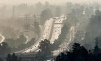 image of big city freeways with smoke