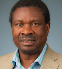 Headshot of Wilson Rumbeiha, Ph.D. with neutral background.