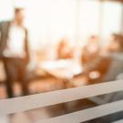 meeting seen blurry through a glass wall
