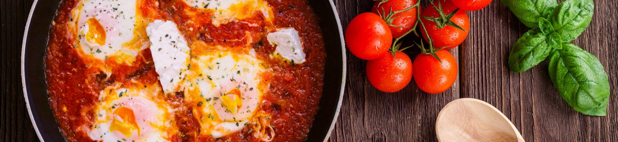 Pan with eggs in tomato sauce 